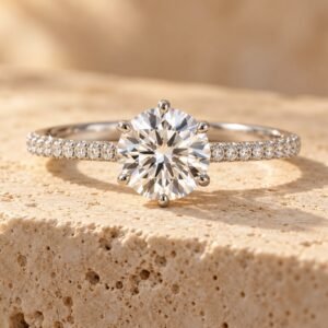 The Celeste ring on warm cream travertine