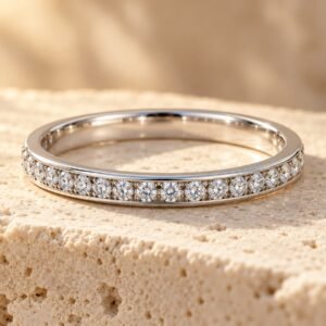 The Toujours ring on warm cream travertine